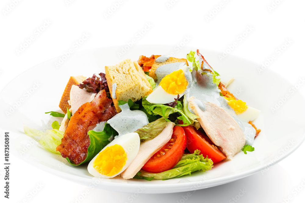 Fresh green salad with chicken, bacon, eggs, tomatoes and croutons Fresh green salad with chicken, bacon, eggs, tomatoes and croutons