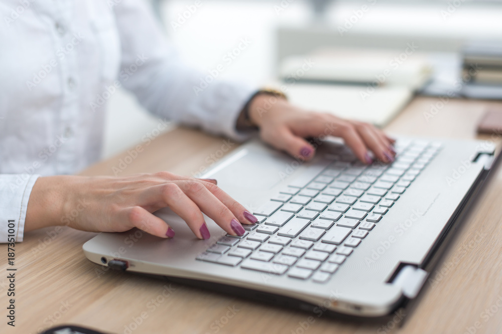 Close up of business woman hand working on laptop computer. Close up of business woman hand working on laptop computer.