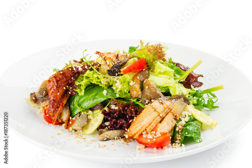 Fresh green salad mix with tomatoes, cucumber, eel, bulgur and oyster mushrooms
