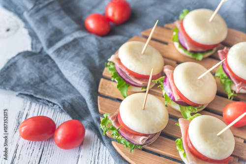 Mini cheese and prosciutto sandwiches photo