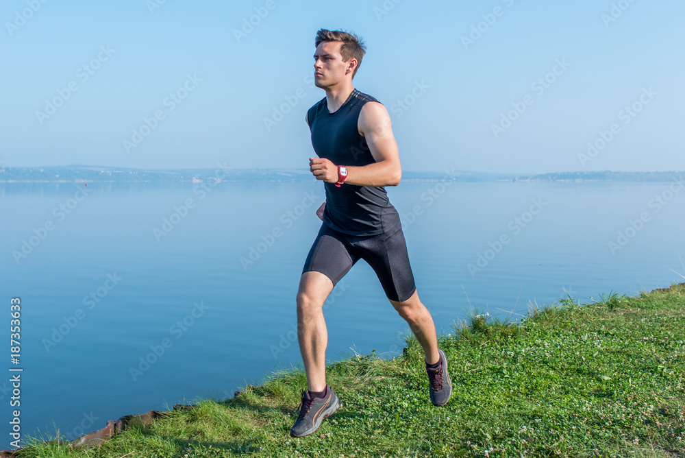Young jogger running in morning Athlete runner working out cardio. Young jogger running in morning Athlete runner working out cardio.