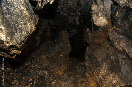 View inside a deep cave. The dark abyss.