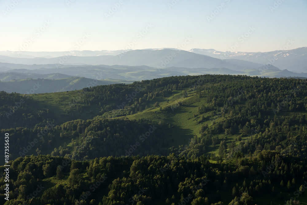 Fototapeta premium Mountain landscape. At a distance you can see the snow on top of the mountain.
