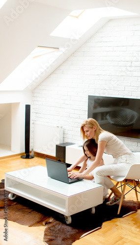Mother and daughter using l...