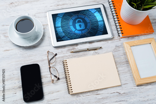 Web security and technology concept with tablet pc on wooden table