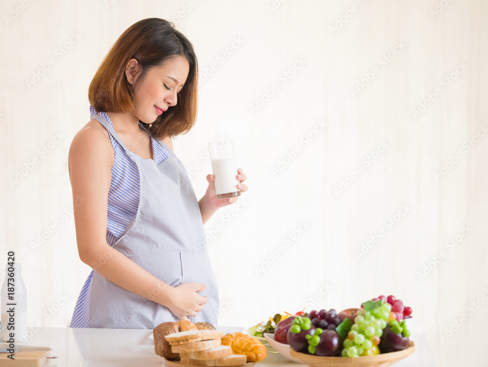 Happy pregnant women drink milk ,healthy nutrition during pregnancy Happy pregnant women drink milk ,healthy nutrition during pregnancy
