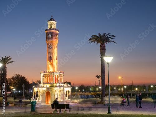 People near clock tower of Izmir at evening , Turkey
