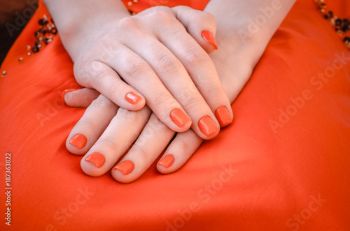 woman hands with red nail polishes