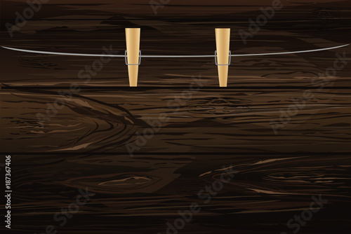 Wooden Cloth pegs hanging on a rope. Empty space for your ad