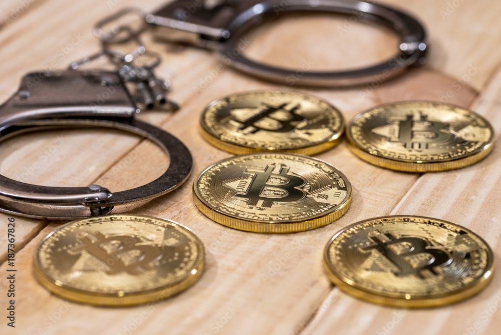 handcuff and gold bitcoin. crime conception