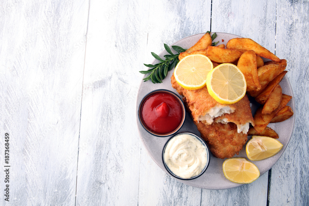 traditional British fish and chips with potato and lemon traditional British fish and chips with potato and lemon