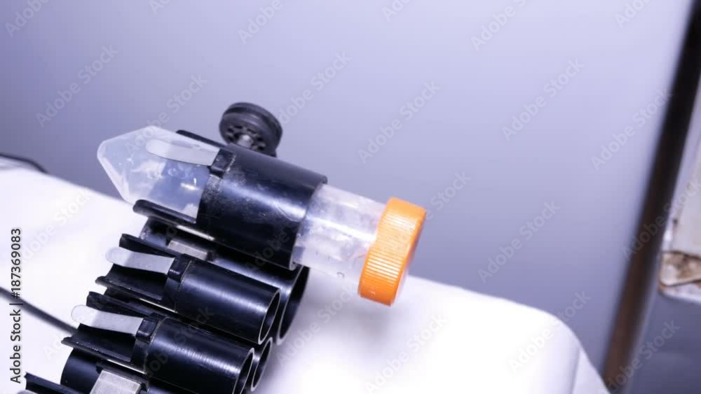 50 ml test-tube in a laboratory rocker 50 ml test-tube in a laboratory rocker