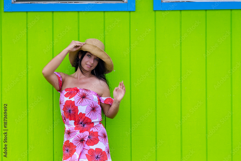 Fototapeta premium Pretty woman in a straw sunhat in Hawaii