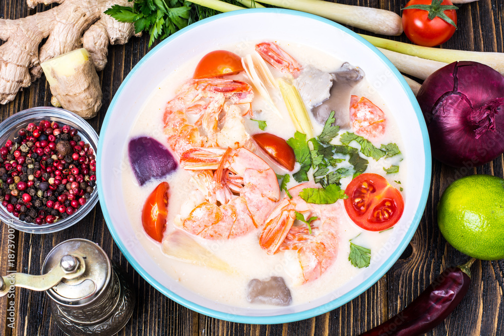 Delicious hot Thai soup Tom Yam with coconut milk and shrimps Delicious hot Thai soup Tom Yam with coconut milk and shrimps