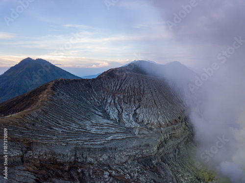 Aerial view from drone to Kawah Ijen volcano crater with sulfur fume. Ijen crater the famous tourist attraction near Banyuwangi  East Java  Indonesia