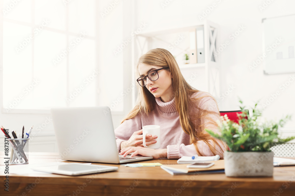 Business woman working on laptop at office Business woman working on laptop at office