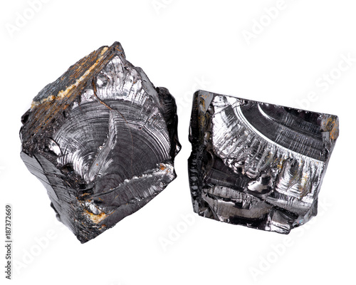 Rough lustrous elite shungite from Russia isolated on white background photo