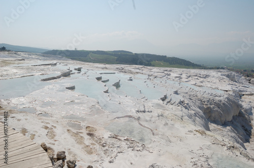 Ancient springs of Pamukkale,Turkey/is a natural and cultural UNESCO world heritage site, includes geothermal springs with water temperature of 36°C, water terraces formed of travertine, travel route 