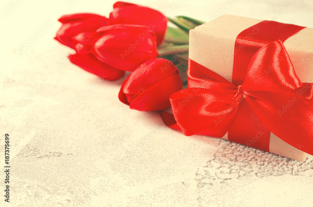 Spring bouquet of red tulips and gift box. Spring bouquet of red tulips and gift box.