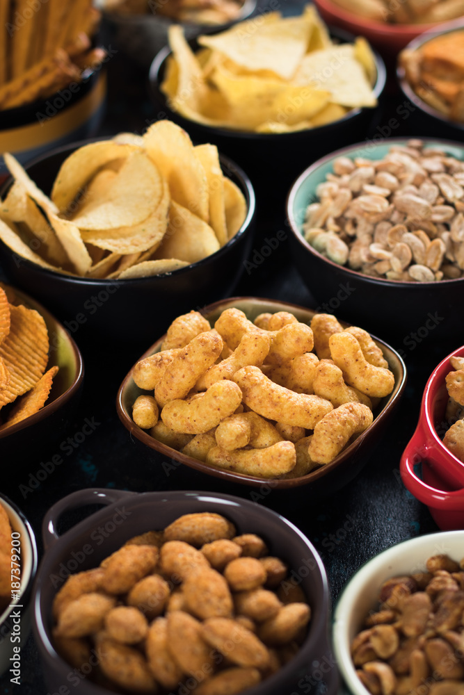 Salty snacks served in bowls Salty snacks served in bowls