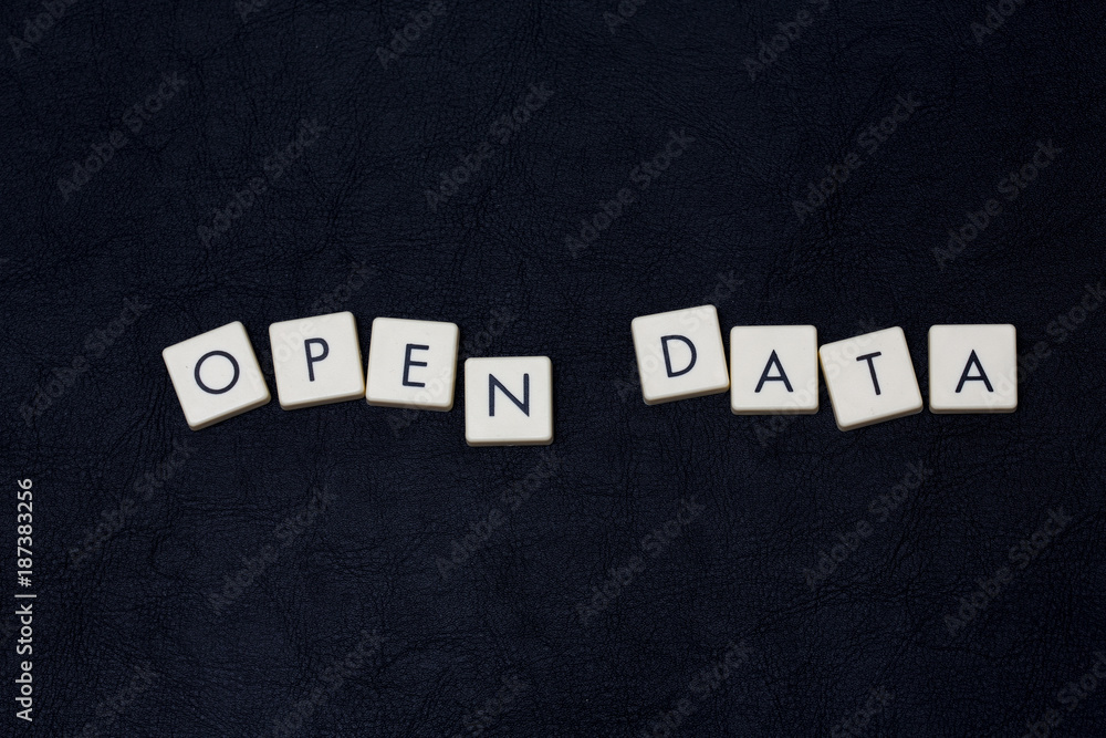 Obraz premium Open data text on a black leather surface. 