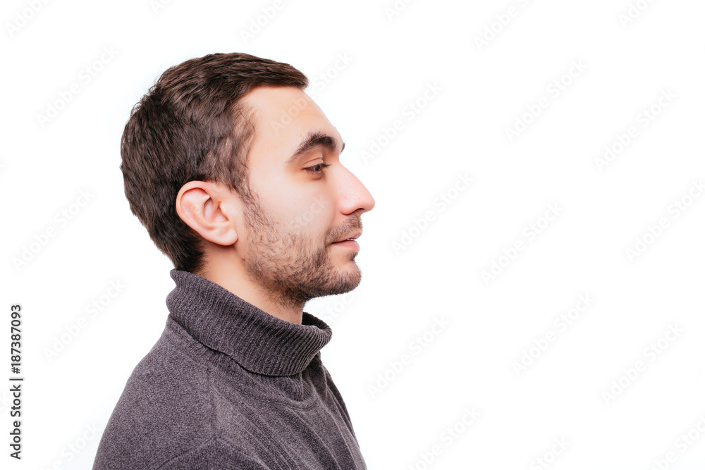Side view portrait of stunning, caucasian man with bristle and crossed hands looking at copy space, standing over whute background Side view portrait of stunning, caucasian man with bristle and crossed hands looking at copy space, standing over whute background