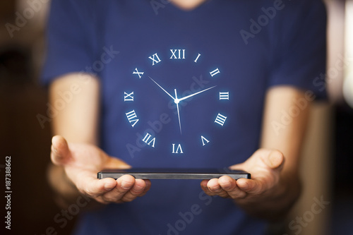 Businessman hand tablet with clock in screen