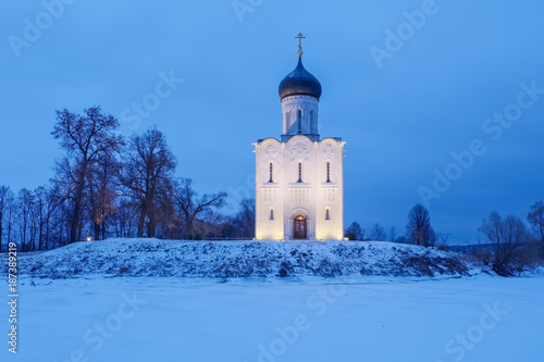 Ancient Russian Church of the Intercession on the Nerl with illumination in the winter twilight