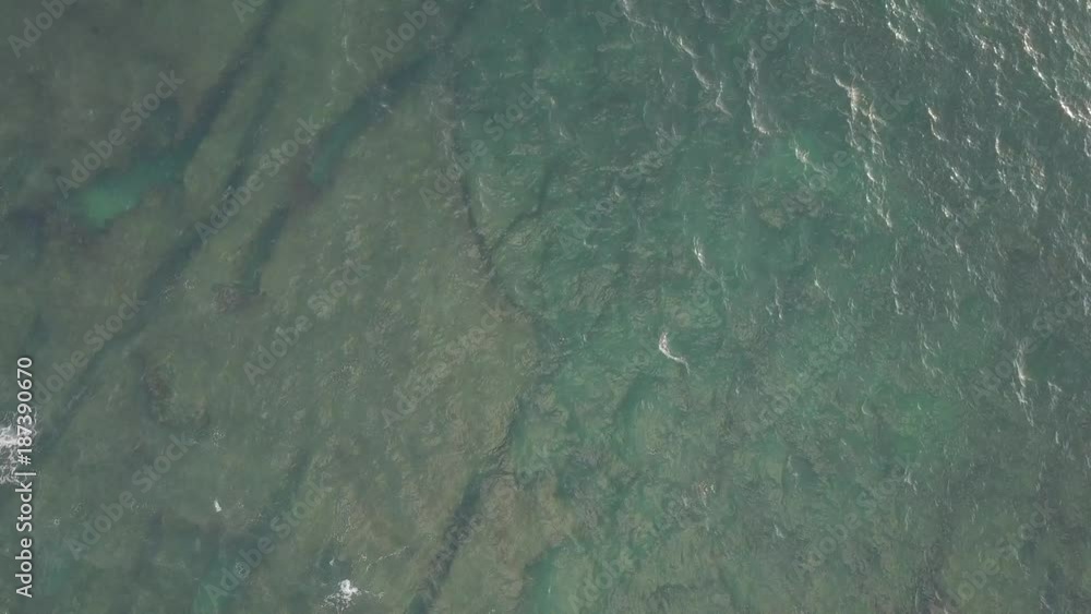 Top view on ocean with reef. Big waves. Surf spot. Drone fly over water. Blue water. Wild ocean. Top view on ocean with reef. Big waves. Surf spot. Drone fly over water. Blue water. Wild ocean.