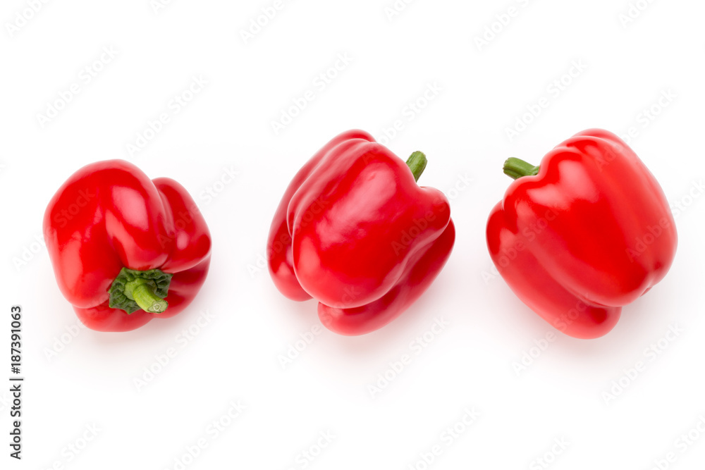 Red bell pepper with half and leaves isolated on white. Red bell pepper with half and leaves isolated on white.