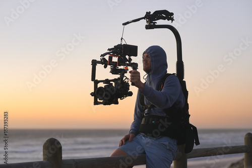 Man with stabiliser camera rig photo