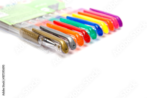 A set  colored pens on a white background