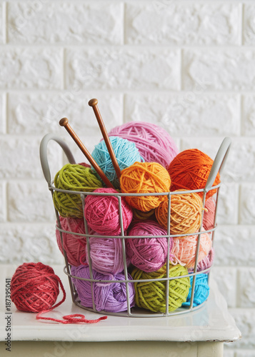 Close up of assorted yarn and wooden needles