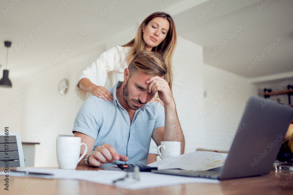 Adult worried couple calculating budget. Adult worried couple calculating budget.