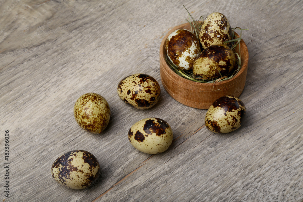 Quail eggs on a wooden background Quail eggs on a wooden background