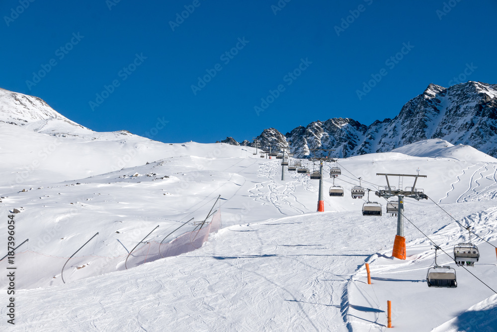 Ski holiday, sunny day in popular Alpine ski resort, Solda (Sulden), South Tyrol, Italy