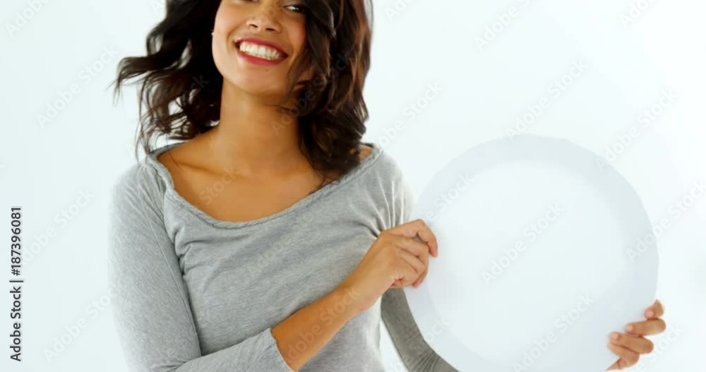 Portrait of female business executive holding blank placard Portrait of female business executive holding blank placard