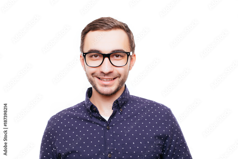 Young man in white shirt and glasses laughing happily isolated on white background