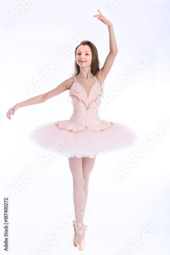 Young ballet dancer seamless white background pink tutu