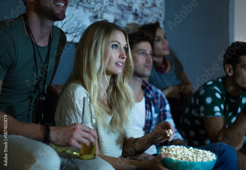 Group of friends watching movie together