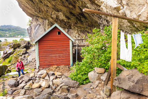 Tourist visiting Helleren houses in Jossingfjord, Norway photo