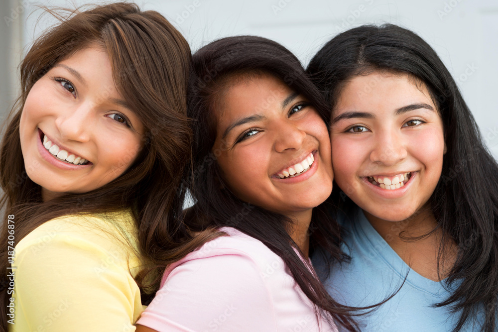 Sisters laughing and having fun outside. Sisters laughing and having fun outside.