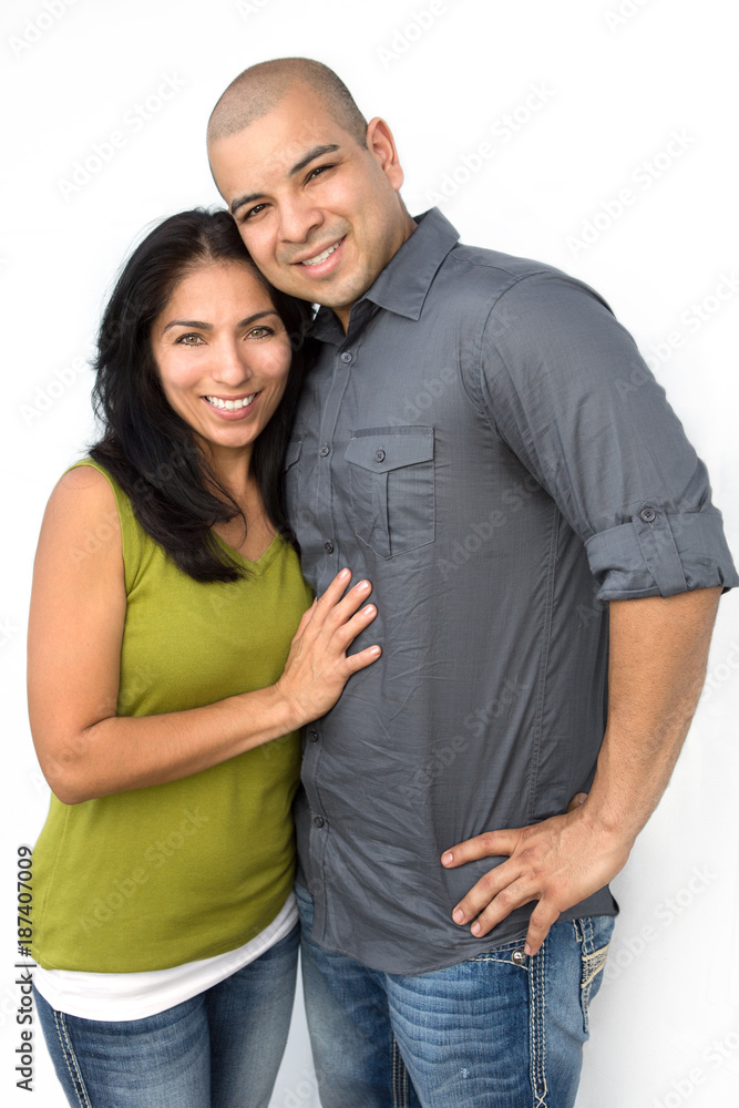 Young Hispanic couple smiling. Young Hispanic couple smiling.
