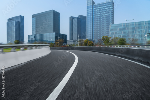 city empty traffic road with cityscape in background