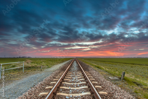 Vanishing railroad in open rural countryside