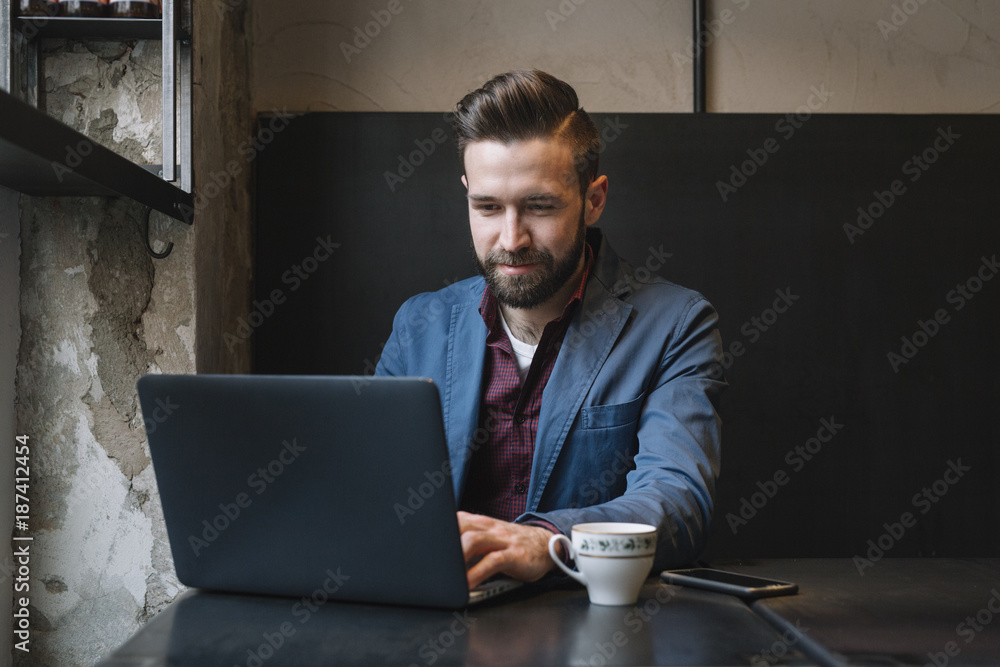 Cheerful man at the laptop Cheerful man at the laptop