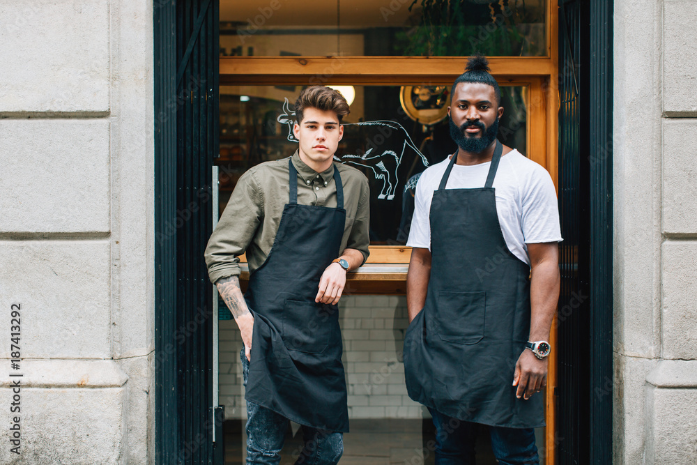 Portrait of the young owners of a cool pastrami bar. Portrait of the young owners of a cool pastrami bar.
