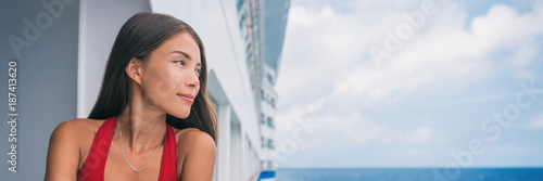 Cruise vacation luxury travel chinese woman portrait on Europe cruise ship holiday in Mediterranean sea. Tourist girl on deck of boat looking at sea, panorama banner.