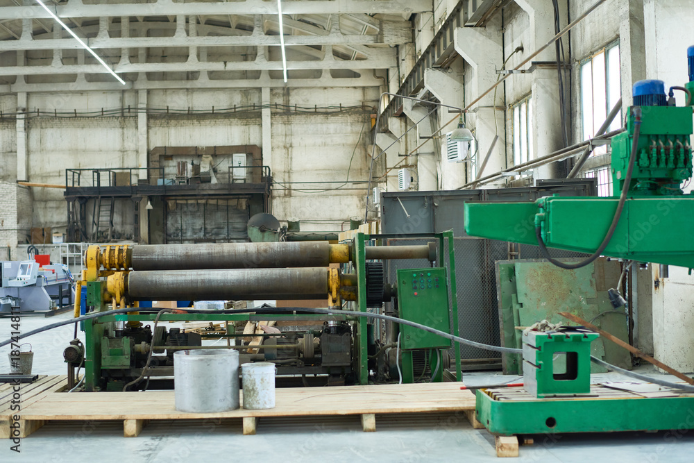 Background image of green industrial machines in spacious workshop of modern plant, copy space