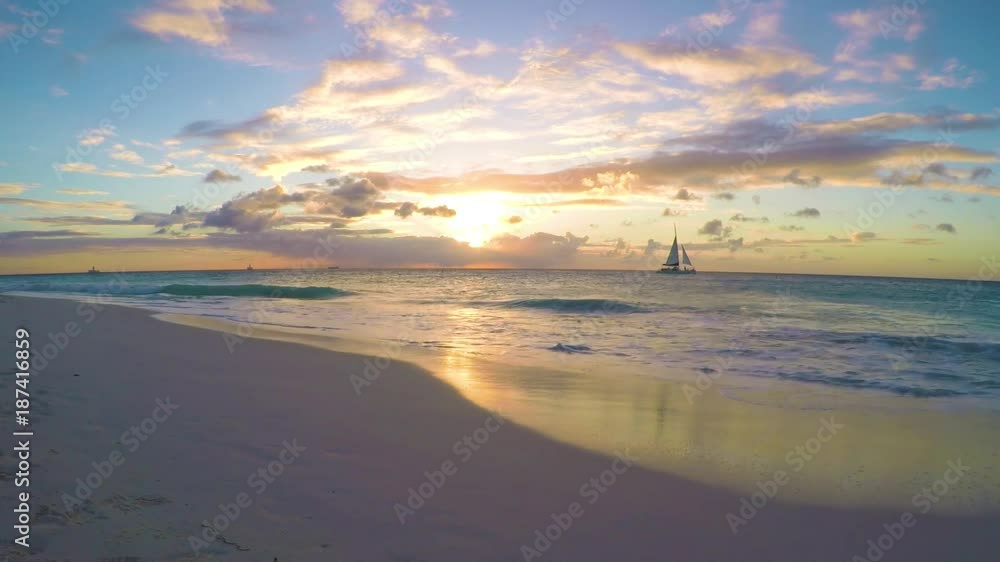 Two sailboats watching the sunset in Aruba Two sailboats watching the sunset in Aruba